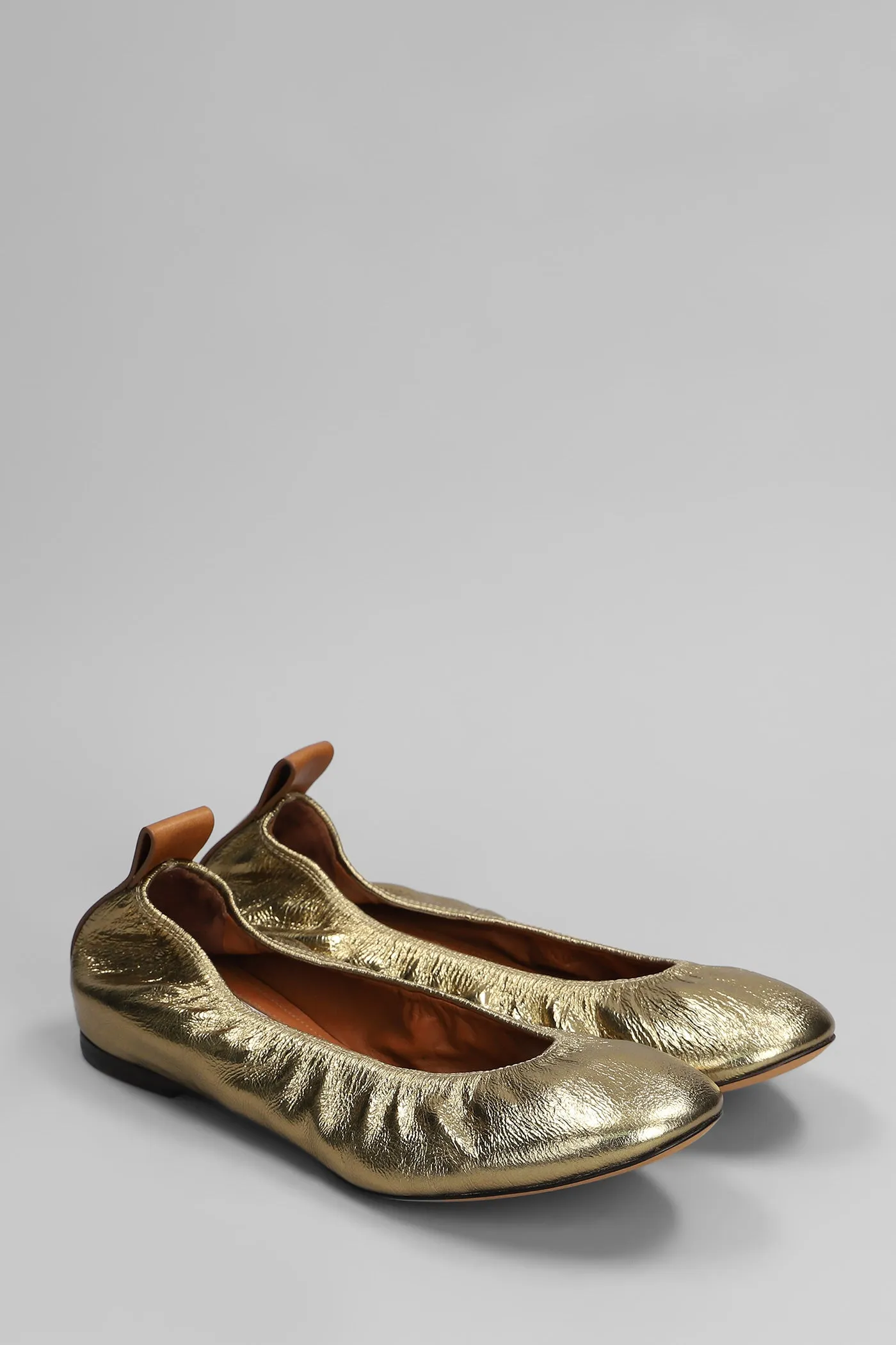 Ballet flats in gold leather