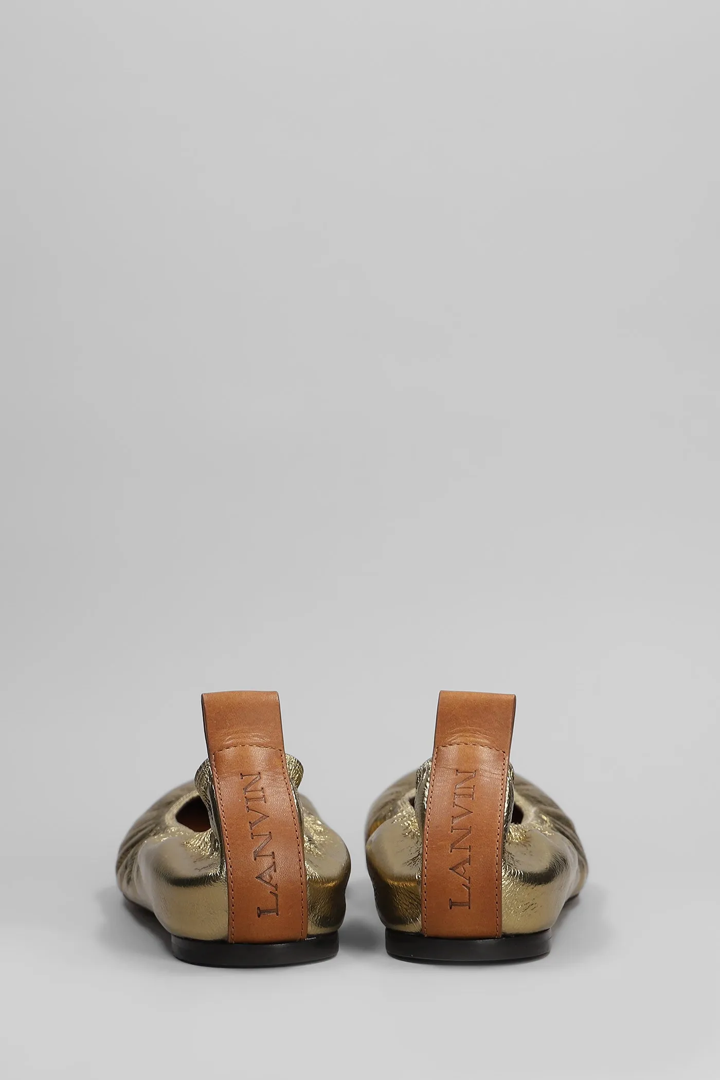 Ballet flats in gold leather