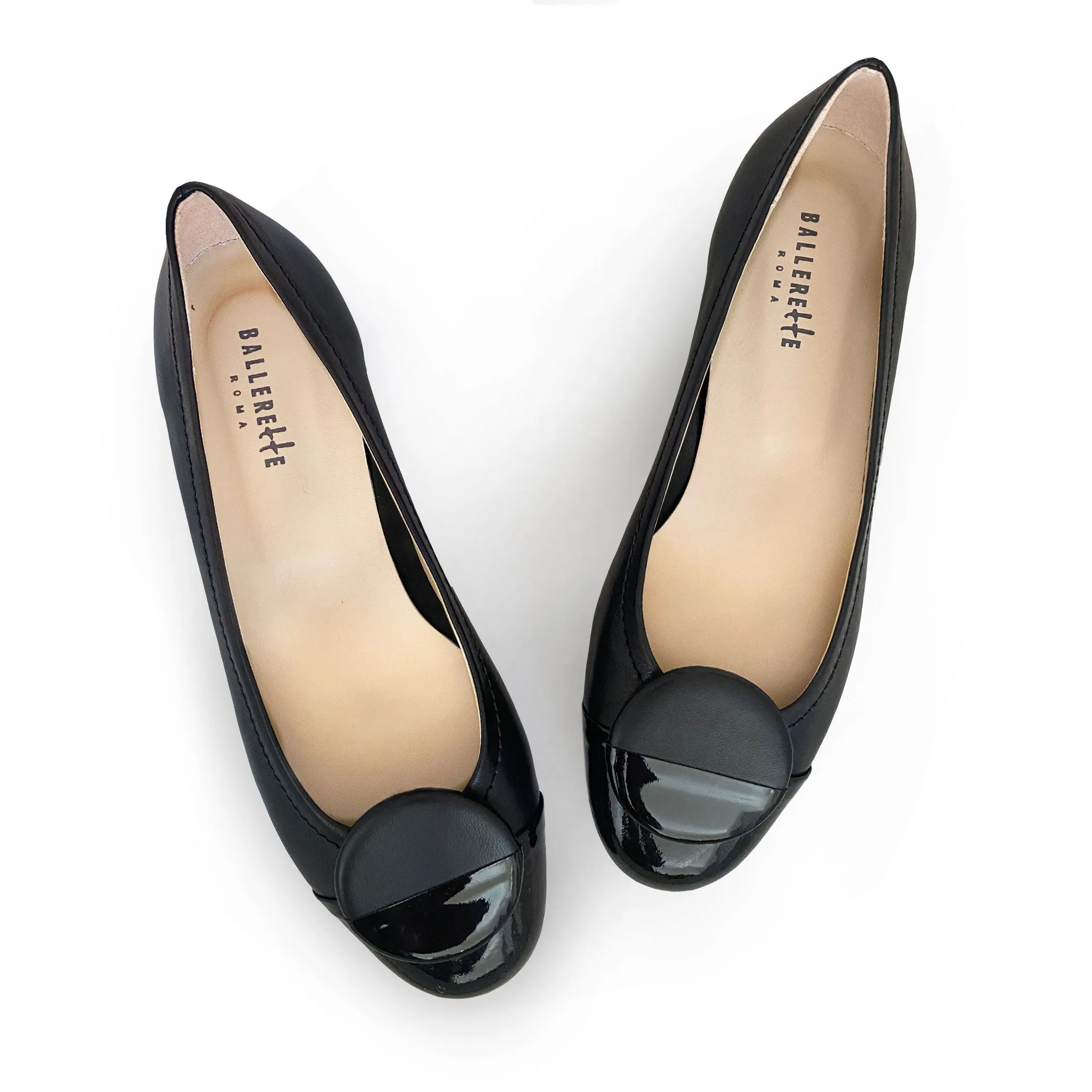Black leather ballet flats with black patent toe and stud