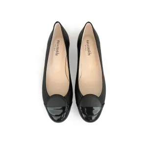 Black leather ballet flats with black patent toe and stud