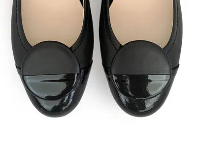 Black leather ballet flats with black patent toe and stud